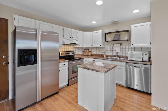 4525 S Cole Ct, Morrison, CO 80465 - kitchen with appliances with stainless steel finishes, a sink, under cabinet range hood, white cabinets, and a center island