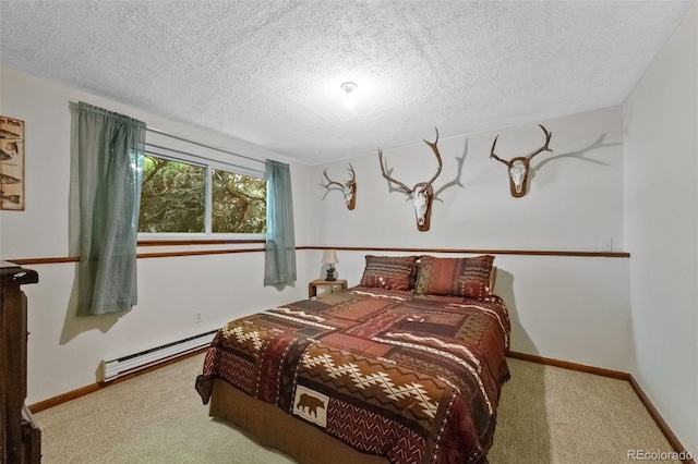 4525 S Cole Ct, Morrison, CO 80465 - carpeted bedroom featuring a baseboard heating unit, a textured ceiling, and baseboards