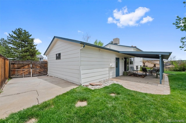4525 S Cole Ct, Morrison, CO 80465 - rear view of house with a patio and a gate