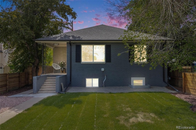1765 Xenia St, Denver, CO 80220 - view of front of home with brick siding and roof with shingles