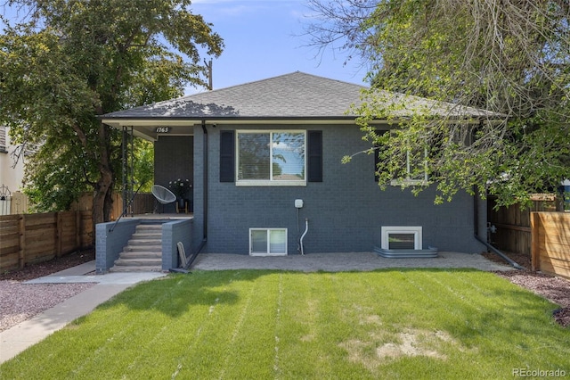 1765 Xenia St, Denver, CO 80220 - rear view of property featuring brick siding and a shingled roof