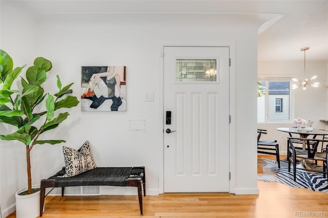 1765 Xenia St, Denver, CO 80220 - foyer featuring a chandelier and light wood-style floors
