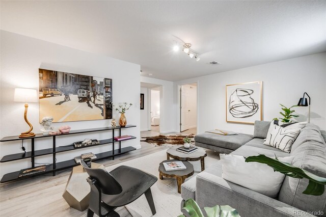 1765 Xenia St, Denver, CO 80220 - living room featuring light wood-style flooring