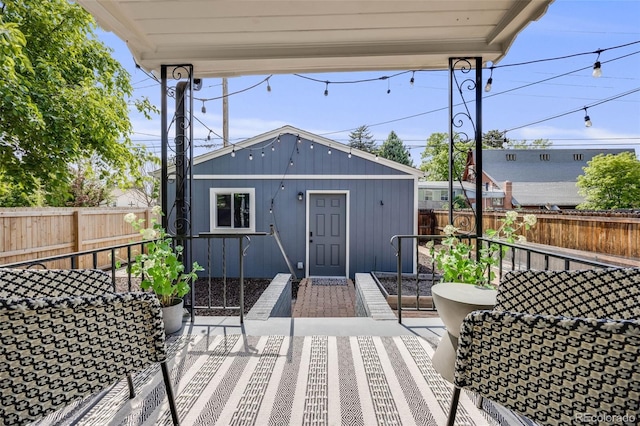 1765 Xenia St, Denver, CO 80220 - deck with a fenced backyard and an outbuilding