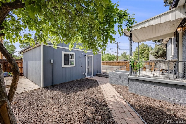 1765 Xenia St, Denver, CO 80220 - fenced backyard with an outdoor structure and a patio area