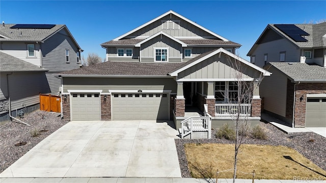 689 Olive St, Broomfield, CO 80023 - craftsman-style home with board and batten siding, a garage, covered porch, a shingled roof, and driveway