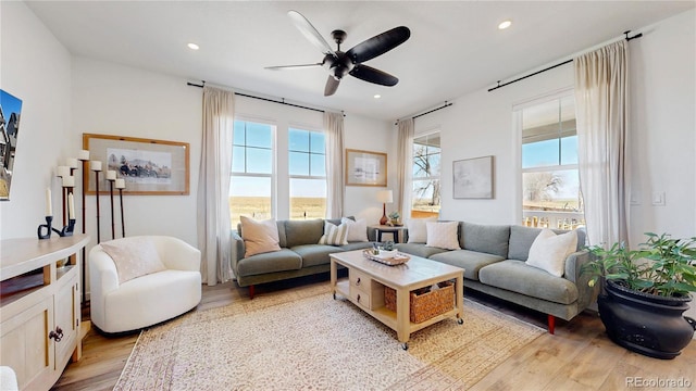 689 Olive St, Broomfield, CO 80023 - living area featuring light wood finished floors, ceiling fan, and recessed lighting