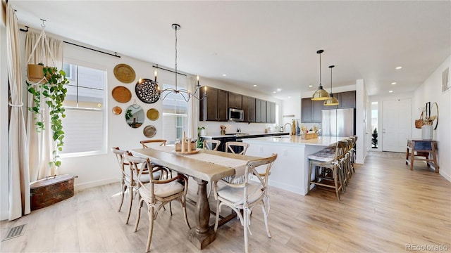 689 Olive St, Broomfield, CO 80023 - dining space with recessed lighting, visible vents, light wood-type flooring, and baseboards