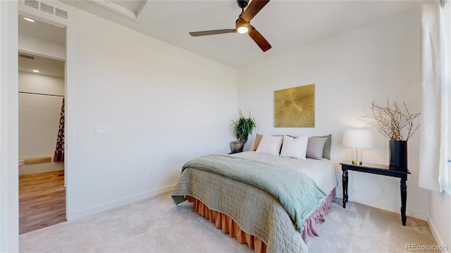 689 Olive St, Broomfield, CO 80023 - bedroom featuring visible vents, baseboards, ceiling fan, and light carpet