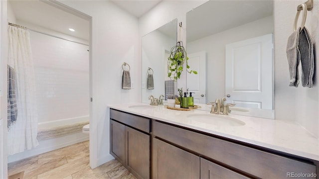 689 Olive St, Broomfield, CO 80023 - full bathroom with a sink, toilet, double vanity, and shower / tub combo with curtain