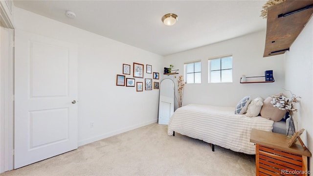 689 Olive St, Broomfield, CO 80023 - bedroom with light carpet and baseboards