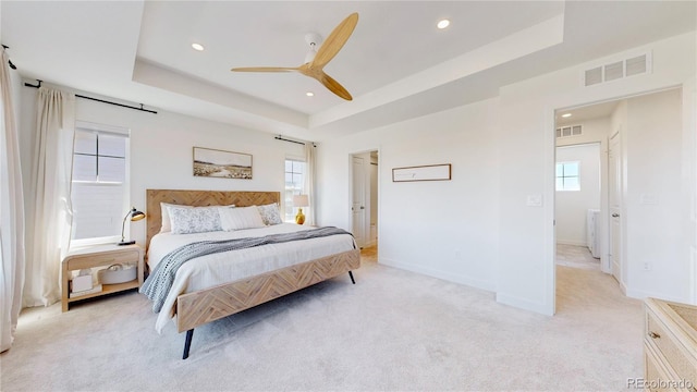 689 Olive St, Broomfield, CO 80023 - bedroom featuring a raised ceiling, light colored carpet, baseboards, and visible vents