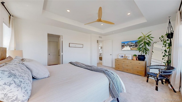 689 Olive St, Broomfield, CO 80023 - bedroom with visible vents, a raised ceiling, a ceiling fan, recessed lighting, and light carpet
