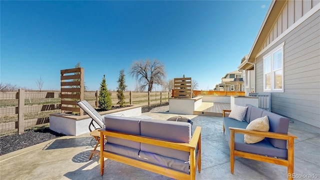 689 Olive St, Broomfield, CO 80023 - view of patio with an outdoor living space and fence