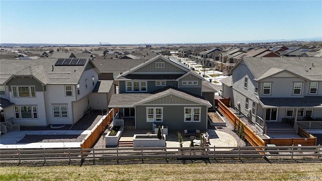 689 Olive St, Broomfield, CO 80023 - rear view of property with a fenced front yard, a residential view, and a patio area