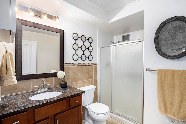 bathroom featuring a stall shower, visible vents, tile walls, and vanity