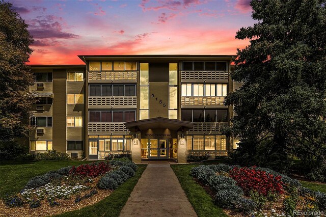 view of outdoor building at dusk