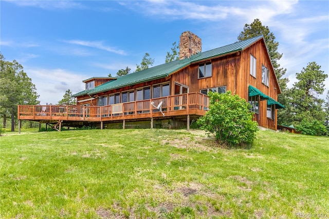 8834 Deiffendeffer Rd, Rye, CO 81069 - rear view of property featuring a metal roof, a yard, a chimney, and a deck