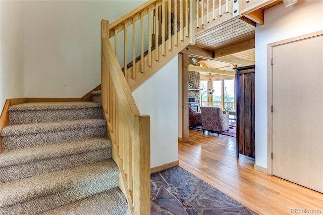 8834 Deiffendeffer Rd, Rye, CO 81069 - stairs with wood finished floors and beam ceiling