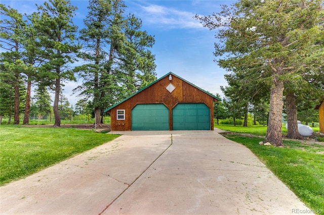 8834 Deiffendeffer Rd, Rye, CO 81069 - view of front of house featuring a garage, a front lawn, and an outdoor structure