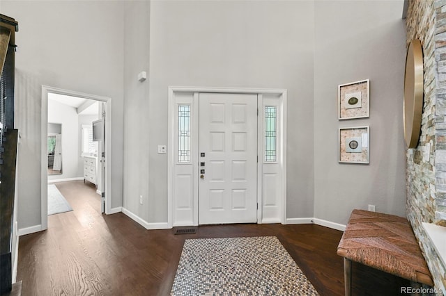 10793 Alcott Way, Denver, CO 80234 - entrance foyer featuring a towering ceiling, dark wood finished floors, and healthy amount of natural light