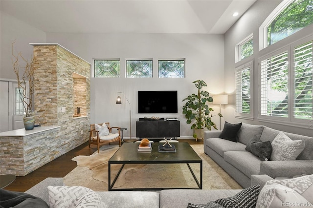10793 Alcott Way, Denver, CO 80234 - living area featuring a towering ceiling and wood finished floors