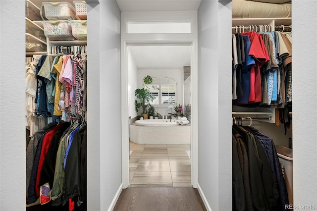 10793 Alcott Way, Denver, CO 80234 - walk in closet featuring wood finished floors