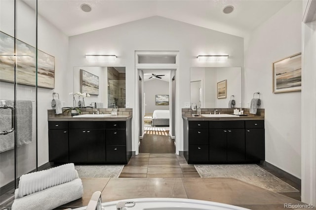 10793 Alcott Way, Denver, CO 80234 - bathroom featuring lofted ceiling, ensuite bathroom, two vanities, a shower stall, and ceiling fan