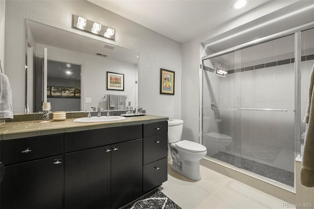 10793 Alcott Way, Denver, CO 80234 - bathroom featuring vanity, a stall shower, and tile patterned floors