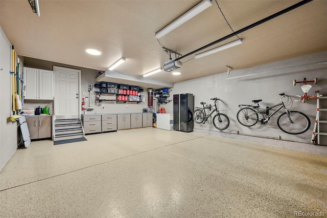 10793 Alcott Way, Denver, CO 80234 - garage with fridge and a garage door opener