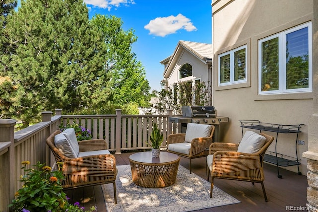 10793 Alcott Way, Denver, CO 80234 - view of wooden balcony with a deck, an outdoor hangout area, and area for grilling