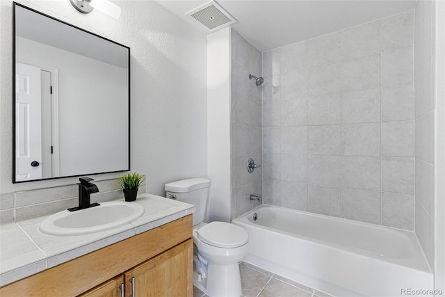 full bath featuring tile patterned floors, visible vents, toilet, shower / tub combination, and vanity