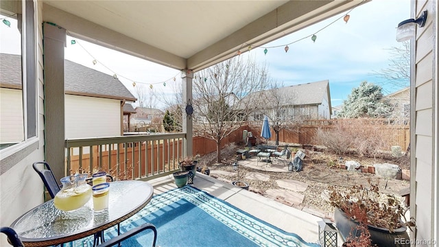 view of pool with outdoor dining space, a patio area, and a fenced backyard