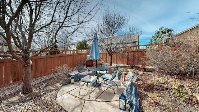 view of patio / terrace with outdoor dining space and a fenced backyard