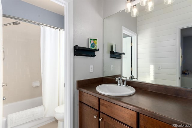 bathroom with shower / bath combination with curtain, vanity, and toilet