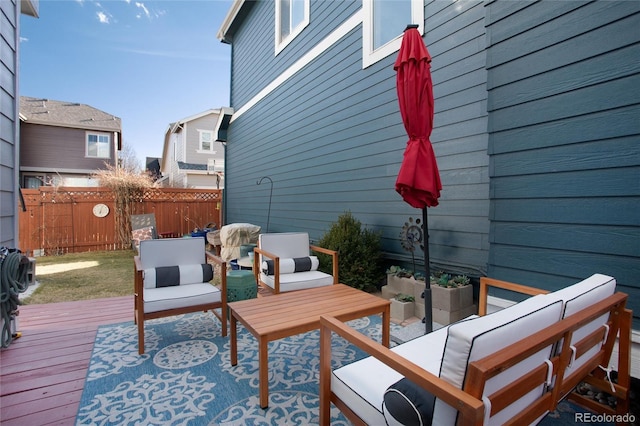 deck featuring fence and outdoor lounge area