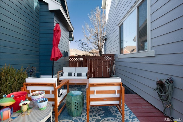 wooden terrace with outdoor lounge area