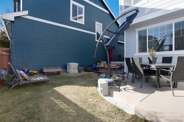 view of patio featuring outdoor dining space and a fire pit