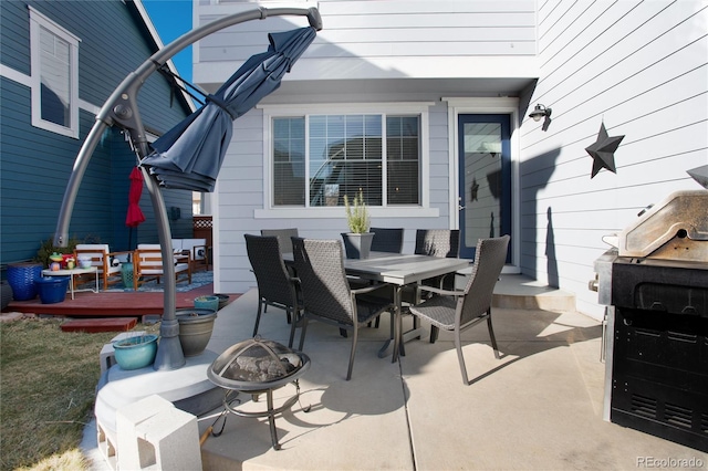 view of patio / terrace featuring an outdoor fire pit and outdoor dining space