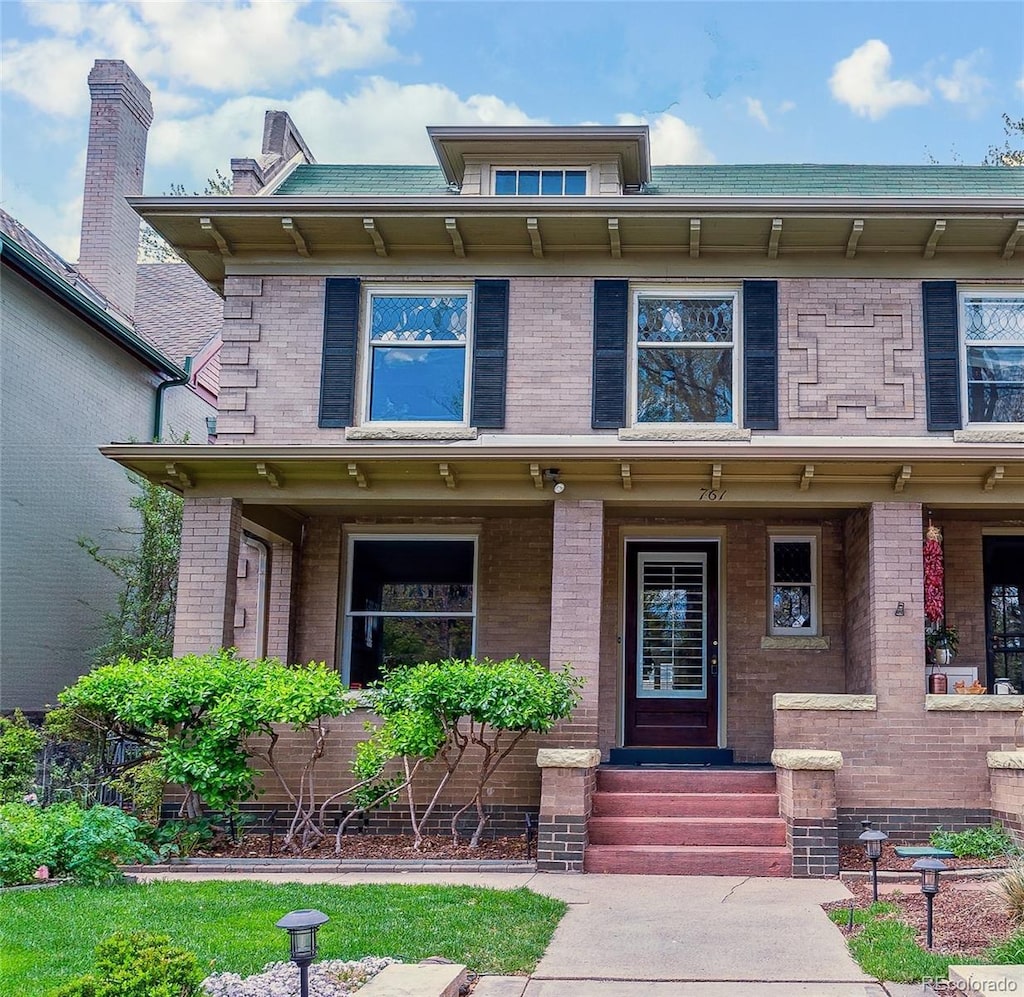 761 N Lafayette St, Denver, CO 80218 - view of front of home with covered porch and brick siding