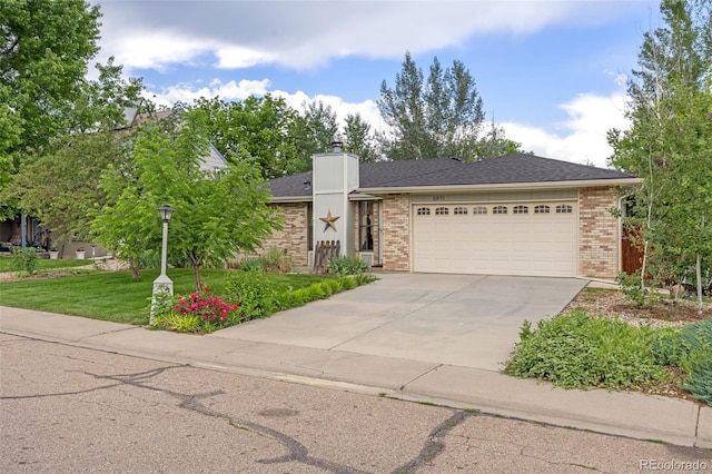 2871 Humboldt Cir, Longmont, CO 80503 - view of front of property with brick siding, an attached garage, driveway, a front lawn, and a chimney