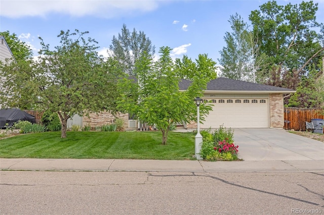 2871 Humboldt Cir, Longmont, CO 80503 - obstructed view of property with brick siding, driveway, and a garage