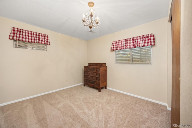 2871 Humboldt Cir, Longmont, CO 80503 - unfurnished bedroom featuring carpet flooring and a chandelier