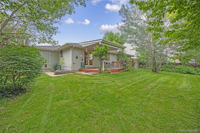2871 Humboldt Cir, Longmont, CO 80503 - back of house featuring a yard