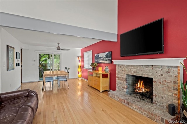 8060 Meadowdale Sq, Niwot, CO 80503 - living area featuring a ceiling fan, wood finished floors, and a brick fireplace