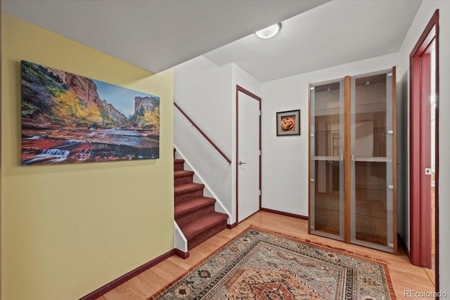 8060 Meadowdale Sq, Niwot, CO 80503 - entryway with light wood finished floors and stairs