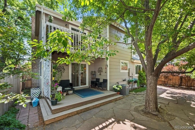 8060 Meadowdale Sq, Niwot, CO 80503 - back of property with a wooden deck and a patio area