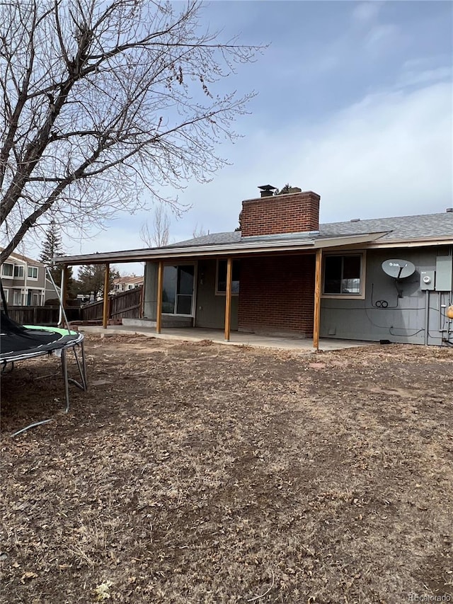 back of property with a trampoline