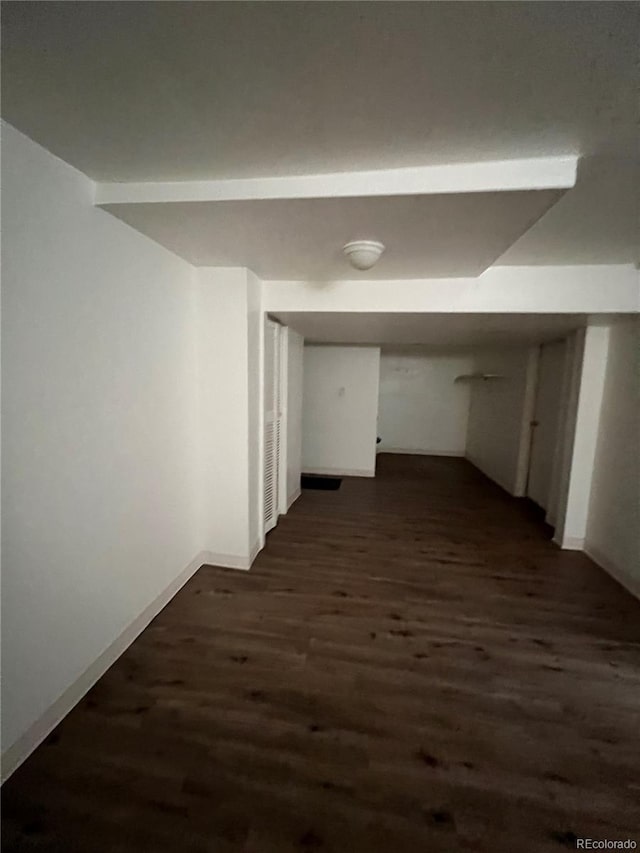 hallway with dark hardwood / wood-style floors