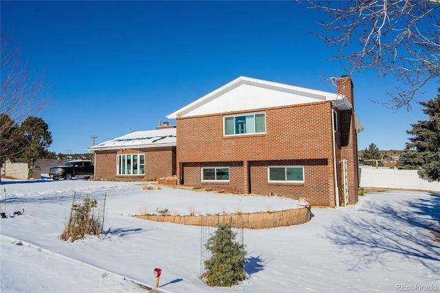 view of snow covered property